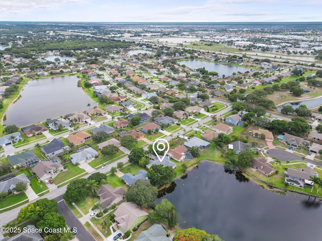 1750 Old Glory Blvd, Melbourne, FL 32940 - aerial overview of property's location with a large body of water and nearby suburban area