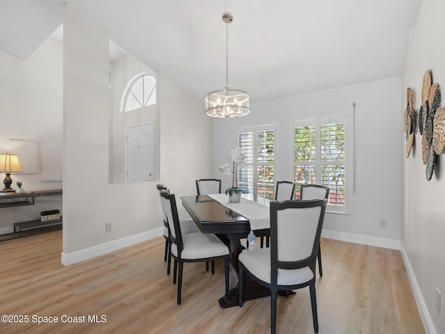 1750 Old Glory Blvd, Melbourne, FL 32940 - dining space with a chandelier, light wood finished floors, and baseboards