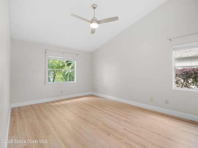 1750 Old Glory Blvd, Melbourne, FL 32940 - spare room featuring lofted ceiling, light wood-type flooring, a ceiling fan, and baseboards