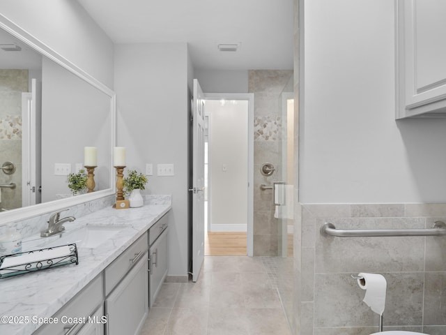 1750 Old Glory Blvd, Melbourne, FL 32940 - full bathroom with vanity, a stall shower, and tile patterned flooring