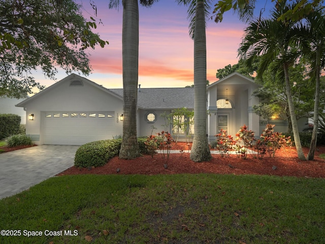 1750 Old Glory Blvd, Melbourne, FL 32940 - view of front of home with a garage and decorative driveway