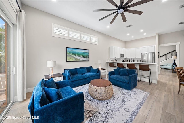 120 Mediterranean Way, Indian Harbour Beach, FL 32937 - living area with a ceiling fan, light wood-type flooring, and recessed lighting