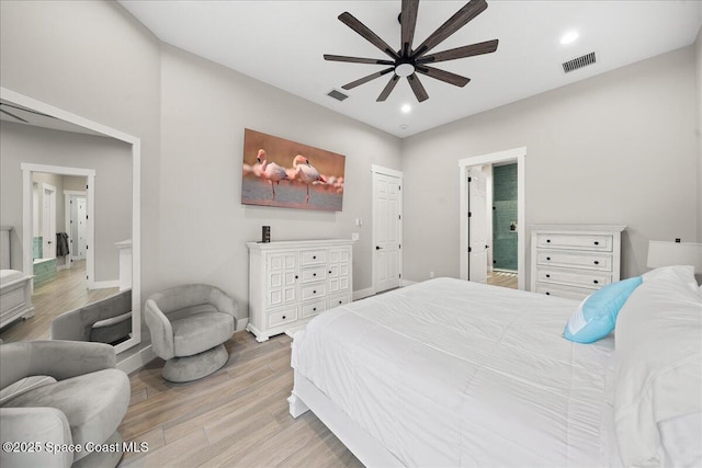 120 Mediterranean Way, Indian Harbour Beach, FL 32937 - bedroom featuring light wood-type flooring, recessed lighting, ensuite bath, and a ceiling fan
