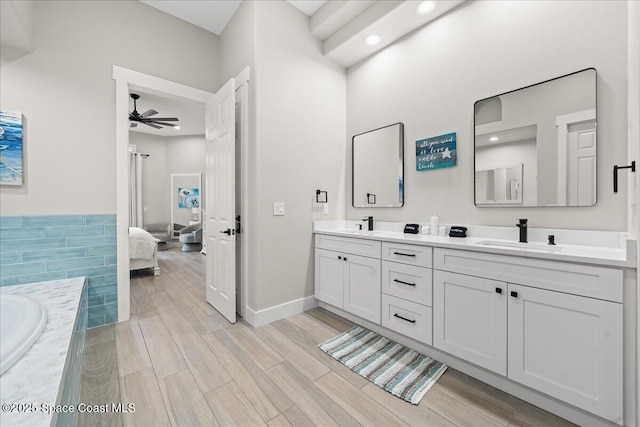 120 Mediterranean Way, Indian Harbour Beach, FL 32937 - bathroom with a ceiling fan, double vanity, a tub, ensuite bath, and wood finished floors