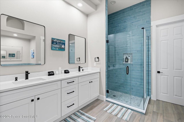 120 Mediterranean Way, Indian Harbour Beach, FL 32937 - full bath featuring double vanity, a shower stall, wood finished floors, and recessed lighting