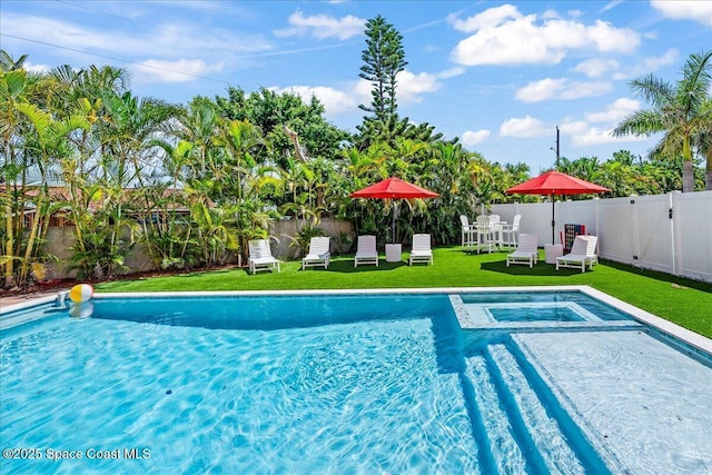 120 Mediterranean Way, Indian Harbour Beach, FL 32937 - view of pool with a fenced backyard and a pool with connected hot tub