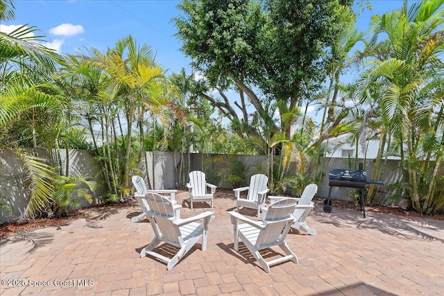 120 Mediterranean Way, Indian Harbour Beach, FL 32937 - fenced backyard with area for grilling and a patio area