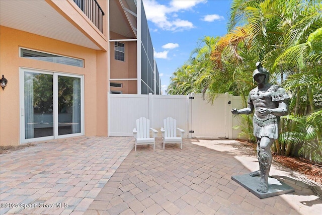 120 Mediterranean Way, Indian Harbour Beach, FL 32937 - fenced backyard featuring a patio and a gate