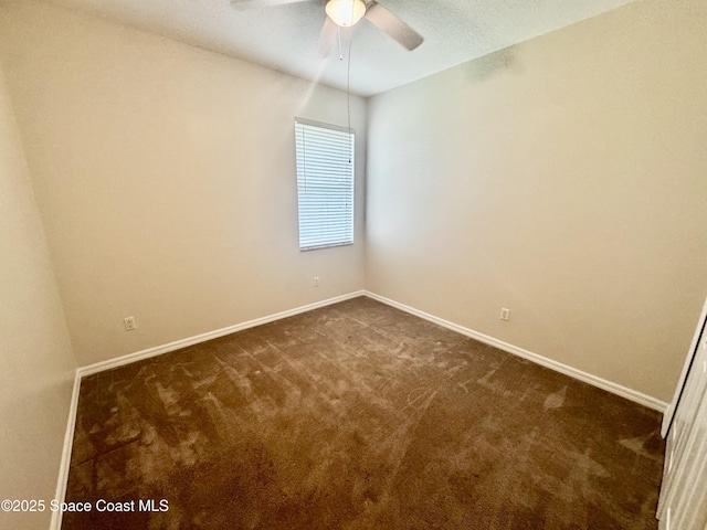 2601 Diane Ave SE, Palm Bay, FL 32909 - unfurnished room featuring dark colored carpet, baseboards, and ceiling fan
