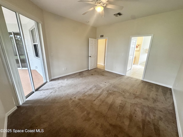 2601 Diane Ave SE, Palm Bay, FL 32909 - unfurnished bedroom featuring access to exterior, light carpet, baseboards, and ceiling fan