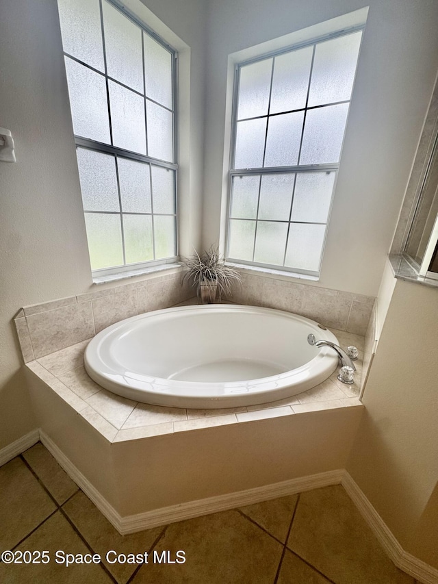 2601 Diane Ave SE, Palm Bay, FL 32909 - full bathroom with a garden tub, tile patterned flooring, and baseboards