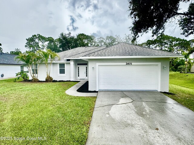 2601 Diane Ave SE, Palm Bay, FL 32909 - ranch-style house featuring stucco siding, roof with shingles, concrete driveway, an attached garage, and a front lawn