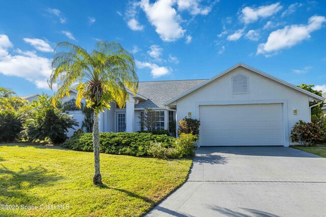 1181 Cypress Trace Dr, Melbourne, FL 32940 - ranch-style home with driveway, an attached garage, a front lawn, and stucco siding