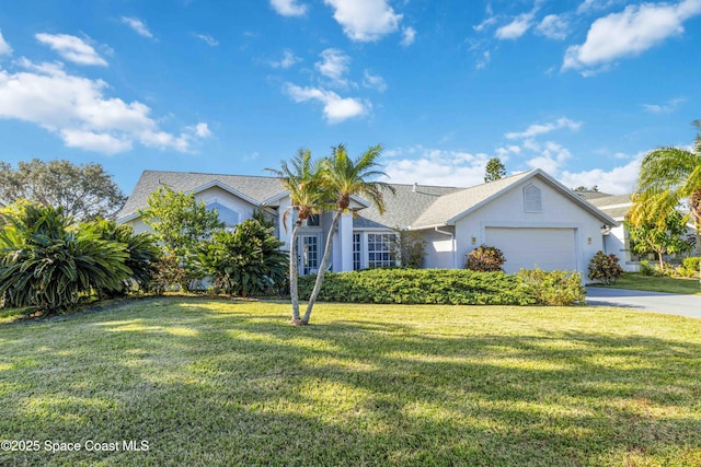 1181 Cypress Trace Dr, Melbourne, FL 32940 - view of front of property with a front yard, an attached garage, driveway, and stucco siding