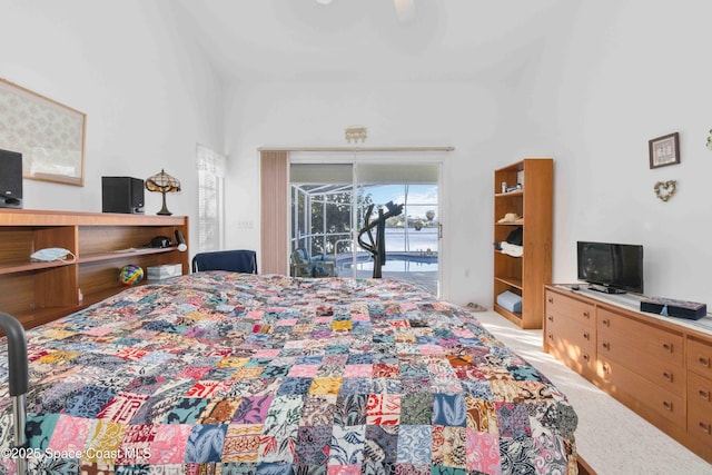 1181 Cypress Trace Dr, Melbourne, FL 32940 - bedroom with access to exterior, a ceiling fan, light carpet, and a towering ceiling