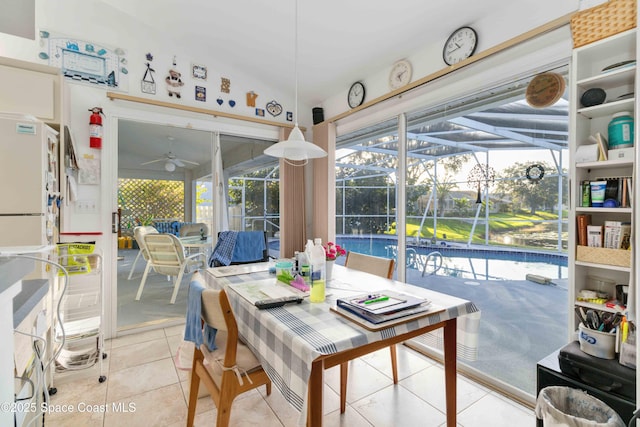 1181 Cypress Trace Dr, Melbourne, FL 32940 - tiled dining space with a sunroom and ceiling fan