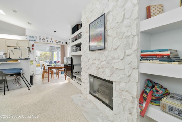 1181 Cypress Trace Dr, Melbourne, FL 32940 - living area with vaulted ceiling and a fireplace