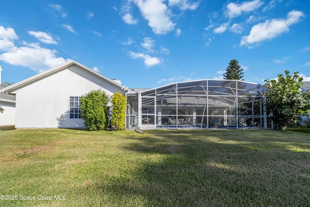 1181 Cypress Trace Dr, Melbourne, FL 32940 - back of property with a yard, stucco siding, and a lanai