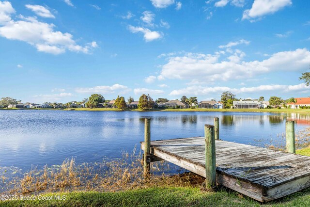 1181 Cypress Trace Dr, Melbourne, FL 32940 - dock area featuring a water view and a residential view