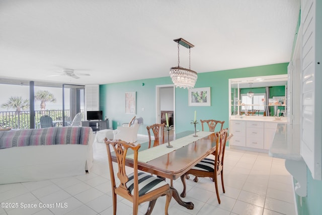 1527 S Atlantic Ave Unit 201, Cocoa Beach, FL 32931 - dining space featuring a ceiling fan and light tile patterned floors