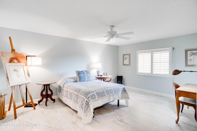 1527 S Atlantic Ave Unit 201, Cocoa Beach, FL 32931 - bedroom featuring baseboards, ceiling fan, and light marble finish flooring
