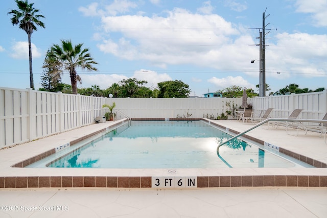 1527 S Atlantic Ave Unit 201, Cocoa Beach, FL 32931 - community pool featuring a patio and a fenced backyard