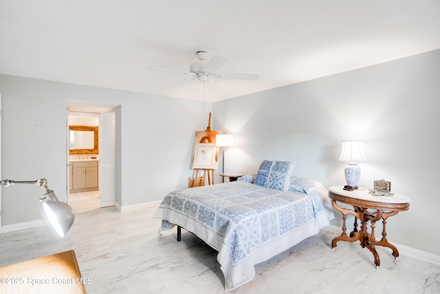 1527 S Atlantic Ave Unit 201, Cocoa Beach, FL 32931 - bedroom with light marble finish floors, baseboards, a ceiling fan, and connected bathroom