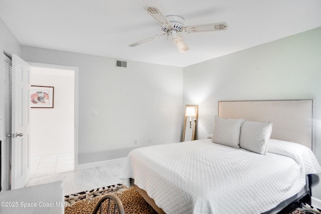 1527 S Atlantic Ave Unit 201, Cocoa Beach, FL 32931 - bedroom with marble finish flooring, ceiling fan, and baseboards