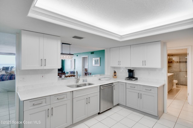 1527 S Atlantic Ave Unit 201, Cocoa Beach, FL 32931 - kitchen featuring stainless steel dishwasher, a sink, light tile patterned floors, and light countertops