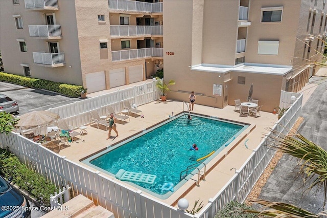 1527 S Atlantic Ave Unit 201, Cocoa Beach, FL 32931 - community pool featuring a patio