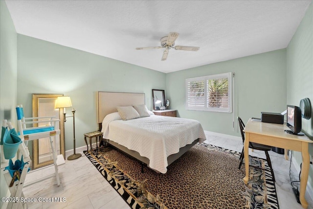 1527 S Atlantic Ave Unit 201, Cocoa Beach, FL 32931 - bedroom featuring marble finish flooring, a desk, and a ceiling fan
