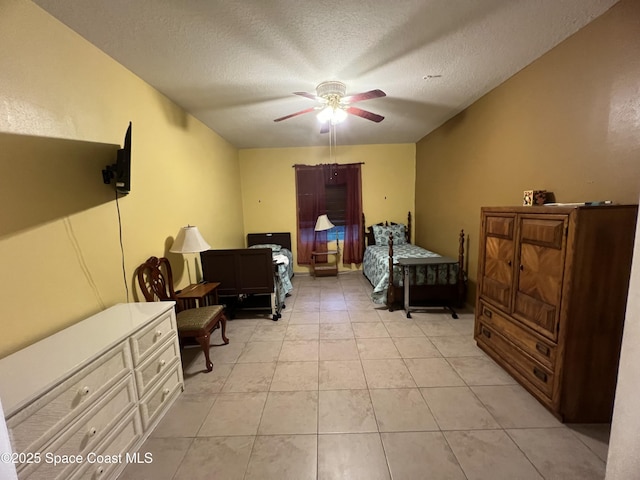 2642 Fleming Ave SW, Palm Bay, FL 32908 - bedroom with a textured ceiling, light tile patterned flooring, and ceiling fan