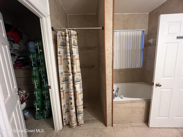 2642 Fleming Ave SW, Palm Bay, FL 32908 - full bath featuring tiled shower, a bath, and tile patterned flooring