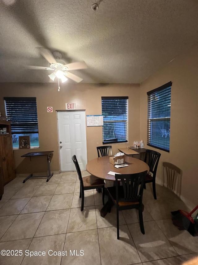 2642 Fleming Ave SW, Palm Bay, FL 32908 - dining room featuring a ceiling fan, a textured ceiling, and light tile patterned flooring