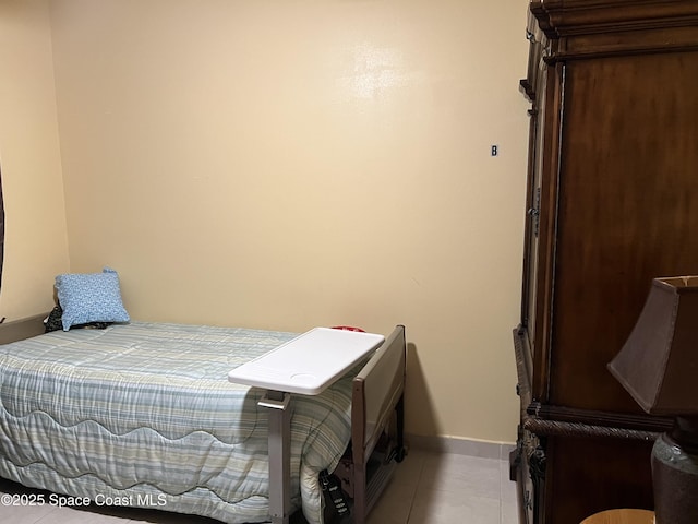 2642 Fleming Ave SW, Palm Bay, FL 32908 - bedroom with baseboards and light tile patterned floors