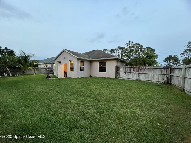 2642 Fleming Ave SW, Palm Bay, FL 32908 - rear view of house with stucco siding