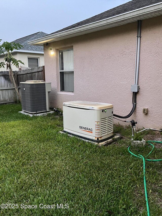 2642 Fleming Ave SW, Palm Bay, FL 32908 - exterior view of a power unit, central air condition unit, and stucco siding