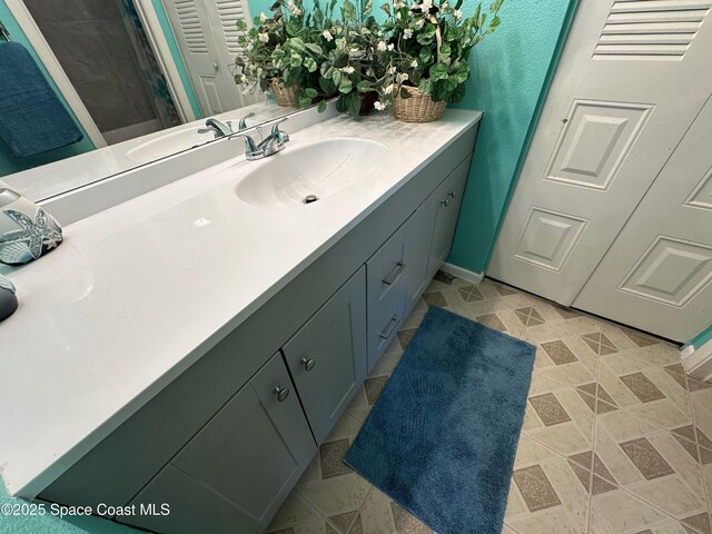 1021 Abada Ct NE Unit 106, Palm Bay, FL 32905 - bathroom with vanity and baseboards