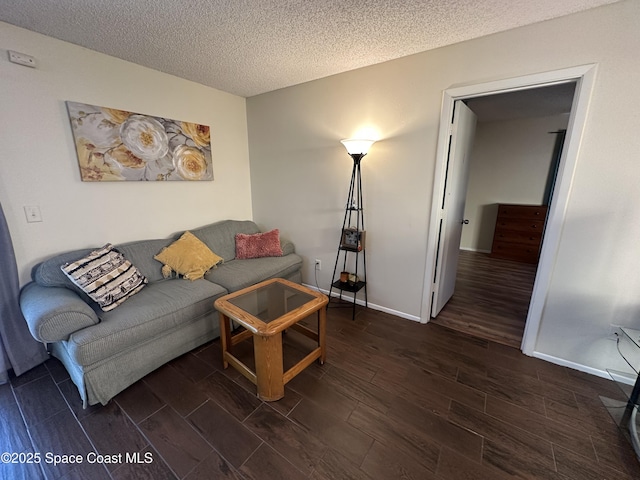 1021 Abada Ct NE Unit 106, Palm Bay, FL 32905 - living room with wood finished floors, a textured ceiling, and baseboards