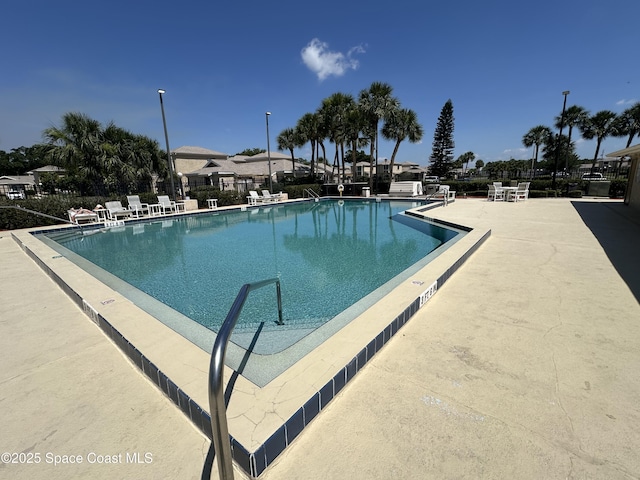 1021 Abada Ct NE Unit 106, Palm Bay, FL 32905 - community pool featuring a patio area