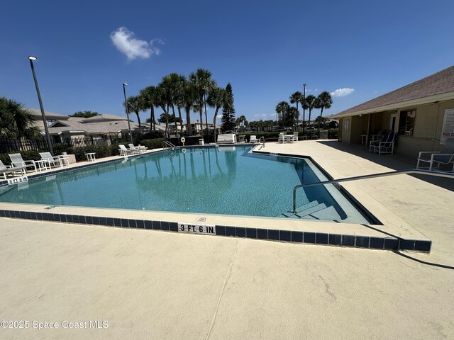 1021 Abada Ct NE Unit 106, Palm Bay, FL 32905 - community pool with a patio area