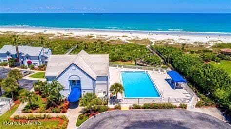 635 Seaport Blvd Unit T257, Cape Canaveral, FL 32920 - view from above of property featuring expansive coastline and a pool area