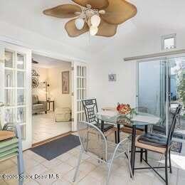 635 Seaport Blvd Unit T257, Cape Canaveral, FL 32920 - tiled dining room featuring a ceiling fan