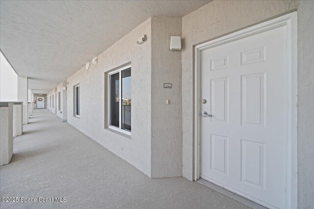 1825 Riverside Dr Unit 205, Titusville, FL 32780 - property entrance with stucco siding