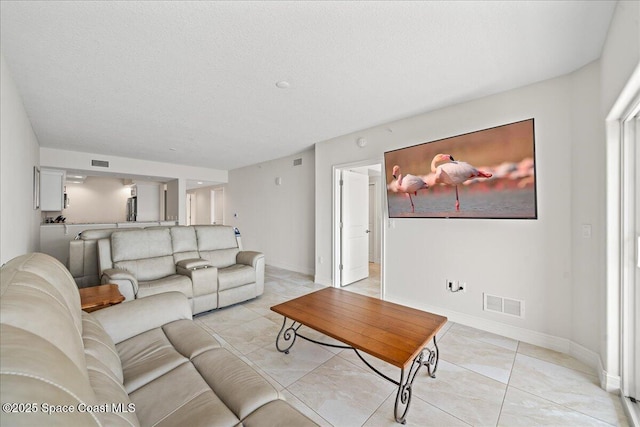 1825 Riverside Dr Unit 205, Titusville, FL 32780 - living room with baseboards and light tile patterned flooring