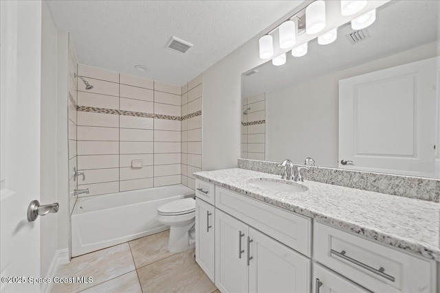 1825 Riverside Dr Unit 205, Titusville, FL 32780 - full bathroom with toilet, vanity, tub / shower combination, tile patterned flooring, and a textured ceiling