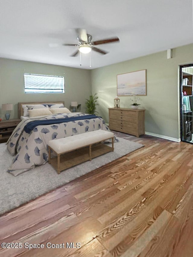 115 Angelo Rd SE, Palm Bay, FL 32909 - bedroom with wood finished floors, baseboards, and a ceiling fan