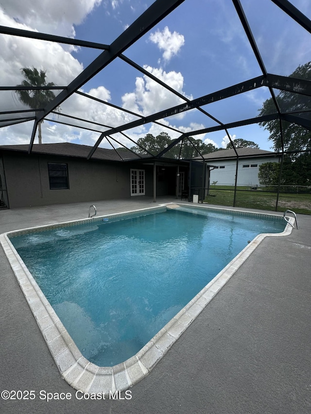 115 Angelo Rd SE, Palm Bay, FL 32909 - swimming pool with a patio area, glass enclosure, french doors, and a yard