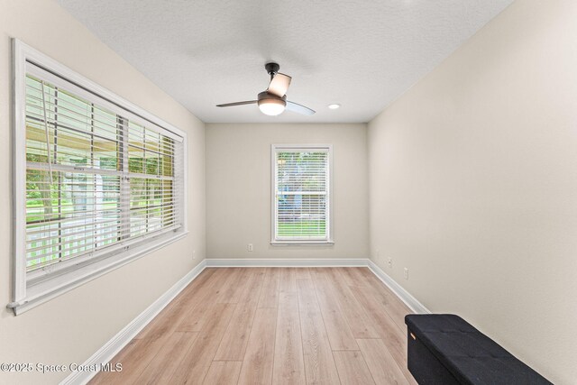 2225 Royal Oaks Dr, Rockledge, FL 32955 - empty room with baseboards, light wood finished floors, ceiling fan, a textured ceiling, and recessed lighting