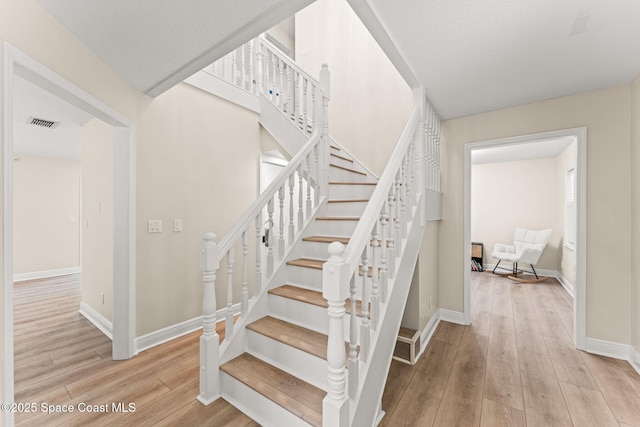 2225 Royal Oaks Dr, Rockledge, FL 32955 - stairway featuring wood finished floors and baseboards